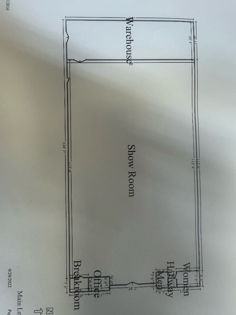 Existing building floor plan survey dated 9/29/2022 showing warehouse, show room, office, and restrooms