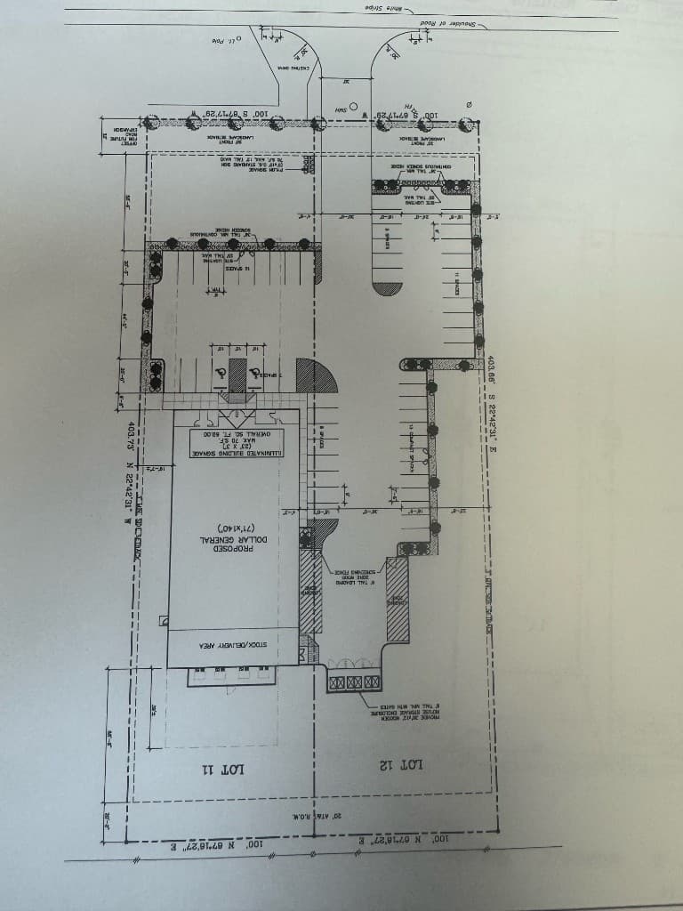 Site plan survey showing Lot 11 and Lot 12, building footprint, parking, and setbacks
